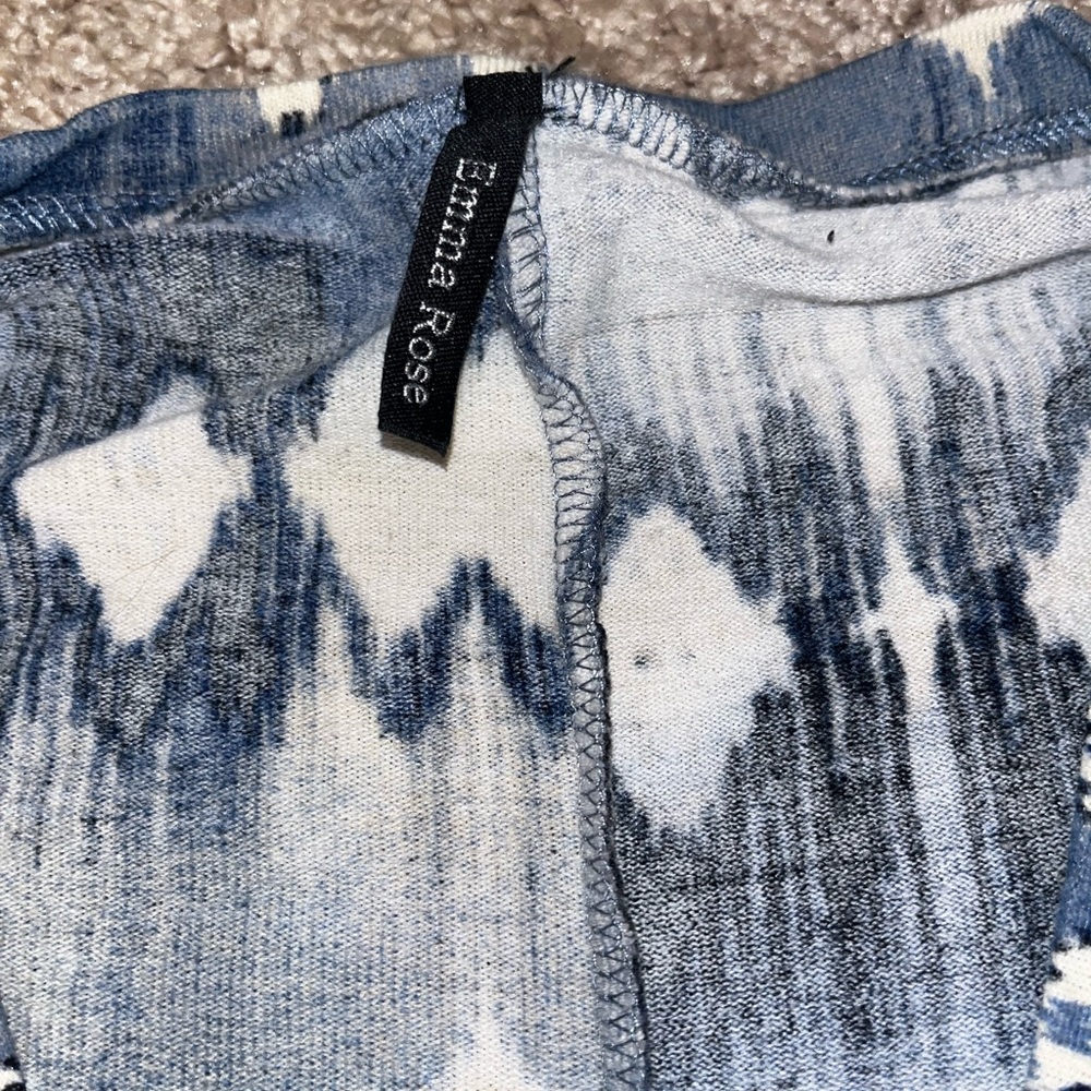 Blue and white long sleeved top.